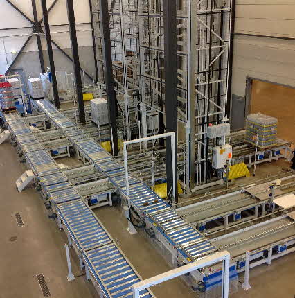 Vertical Lift Pallet Conveyors Being  Fed by Live Roller Conveyor and 3-Strand Chain Conveyor
